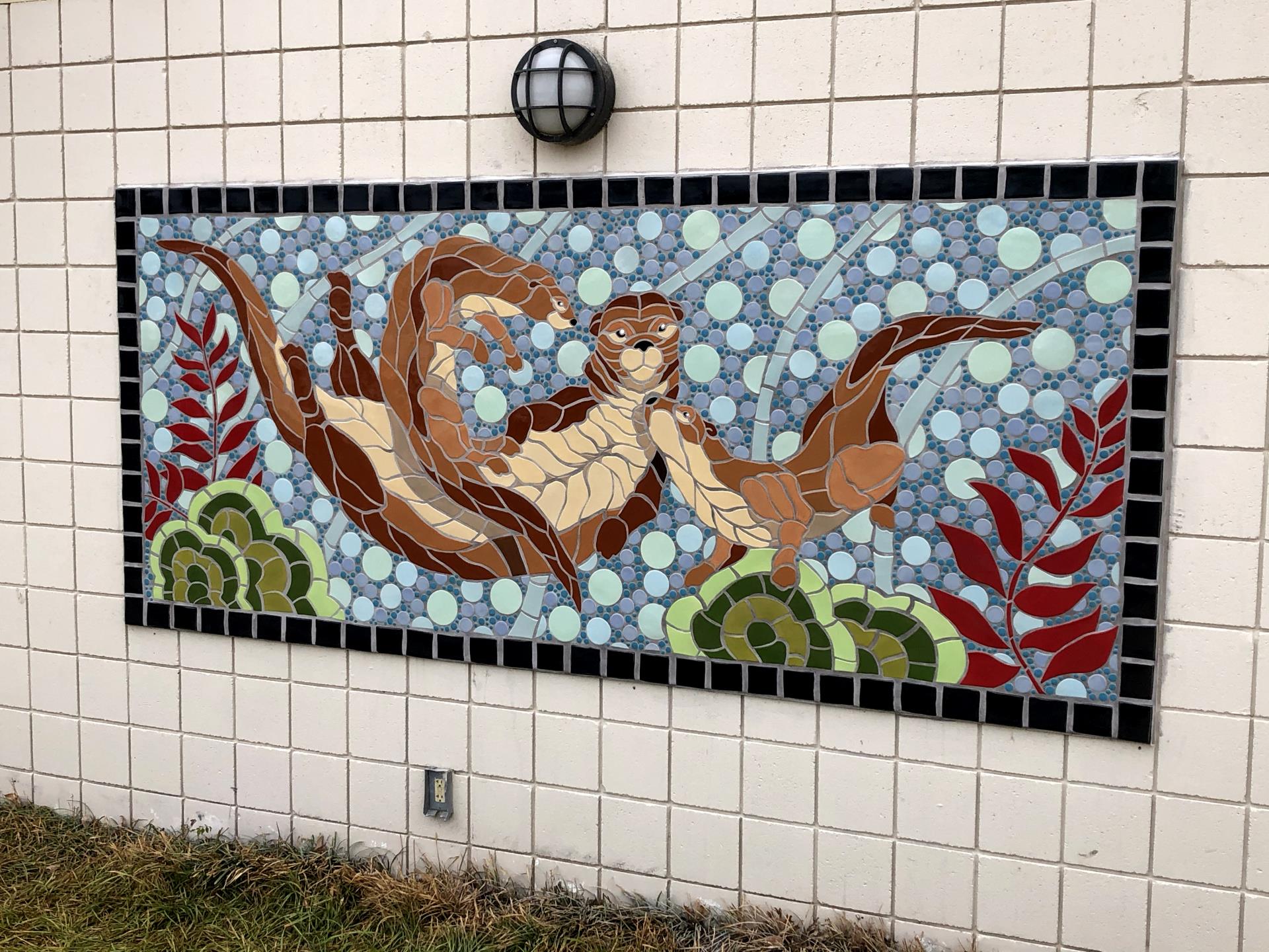 Mosaic of otters at the Earlywine Aquatic Center