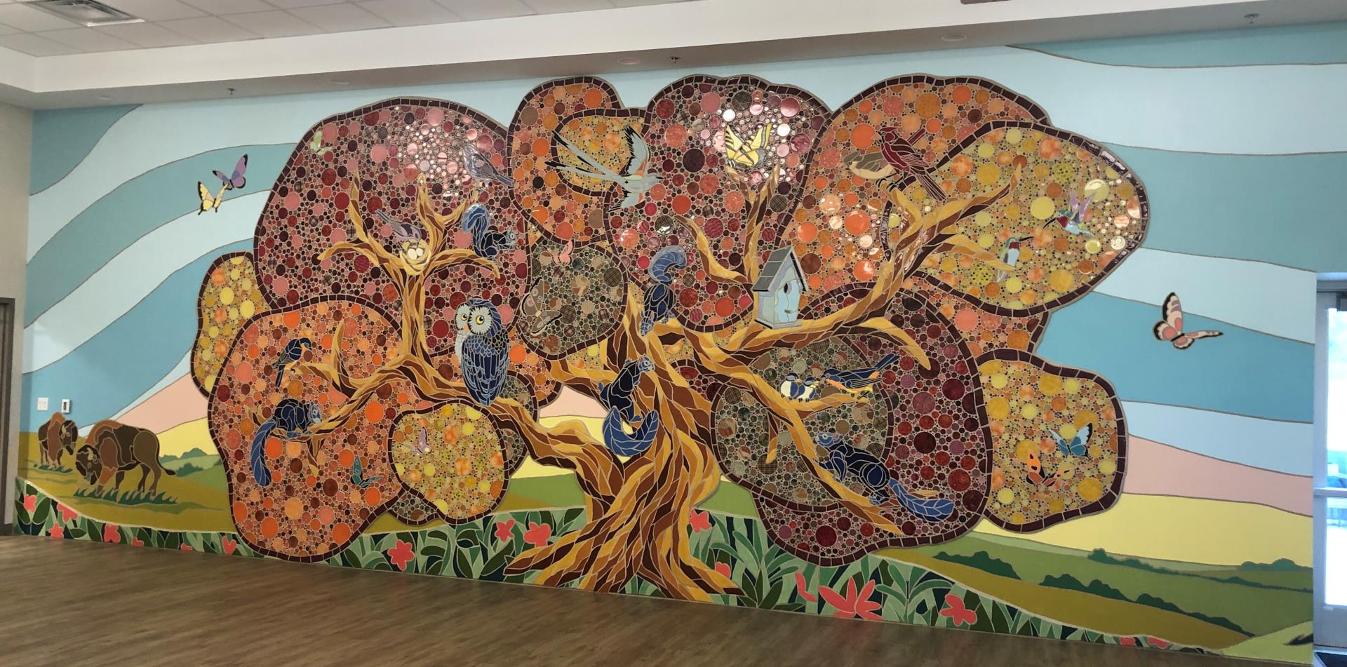 Tile mosaic of a tree at Wellness Center 2