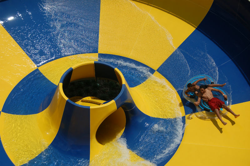 Swimmers enjoy the bowl slide at Earlywine Family Aquatic Center
