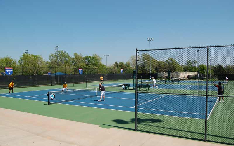 Tennis players enjoy the outdoor courts at the OKC Tennis Center