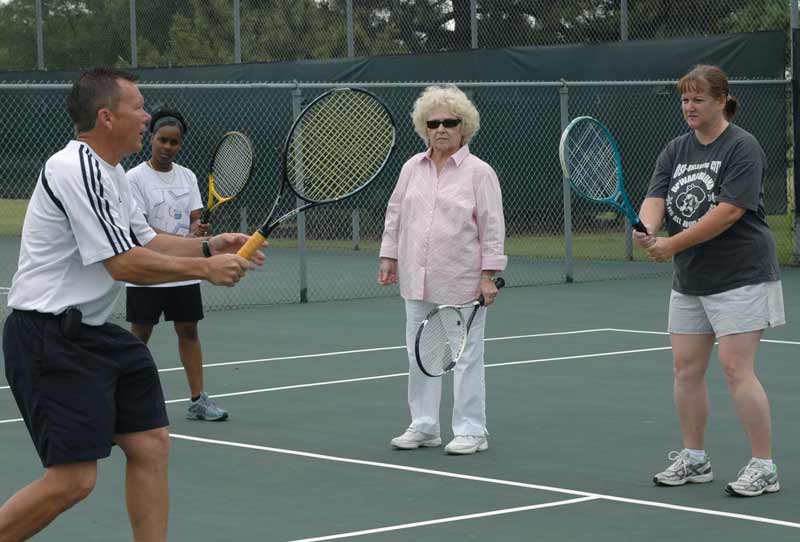 Director of Tennis Steve Henry gives a lesson