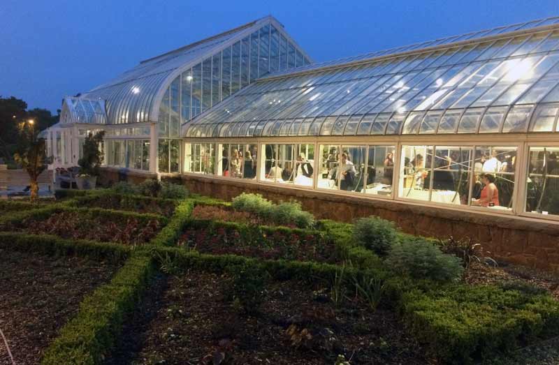 The Ed Lycan Conservatory lights up at night for a beautiful event space