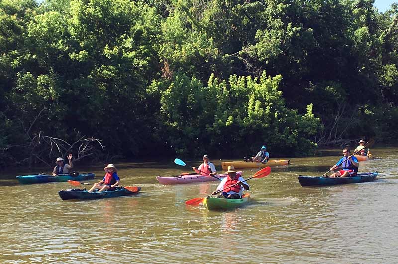 Kayakers enjoy a morning at the Stinchcomb Wildlife Refuge