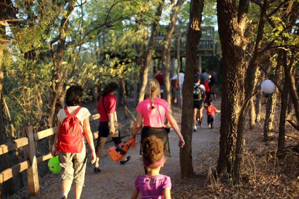 Hikers take to the evening woods in search of treats during "Haunted Hikes"