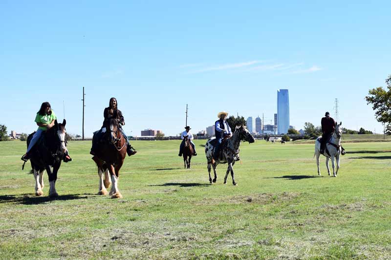 Horseback riders enjoy the downtown views of the equestrian area in River Park